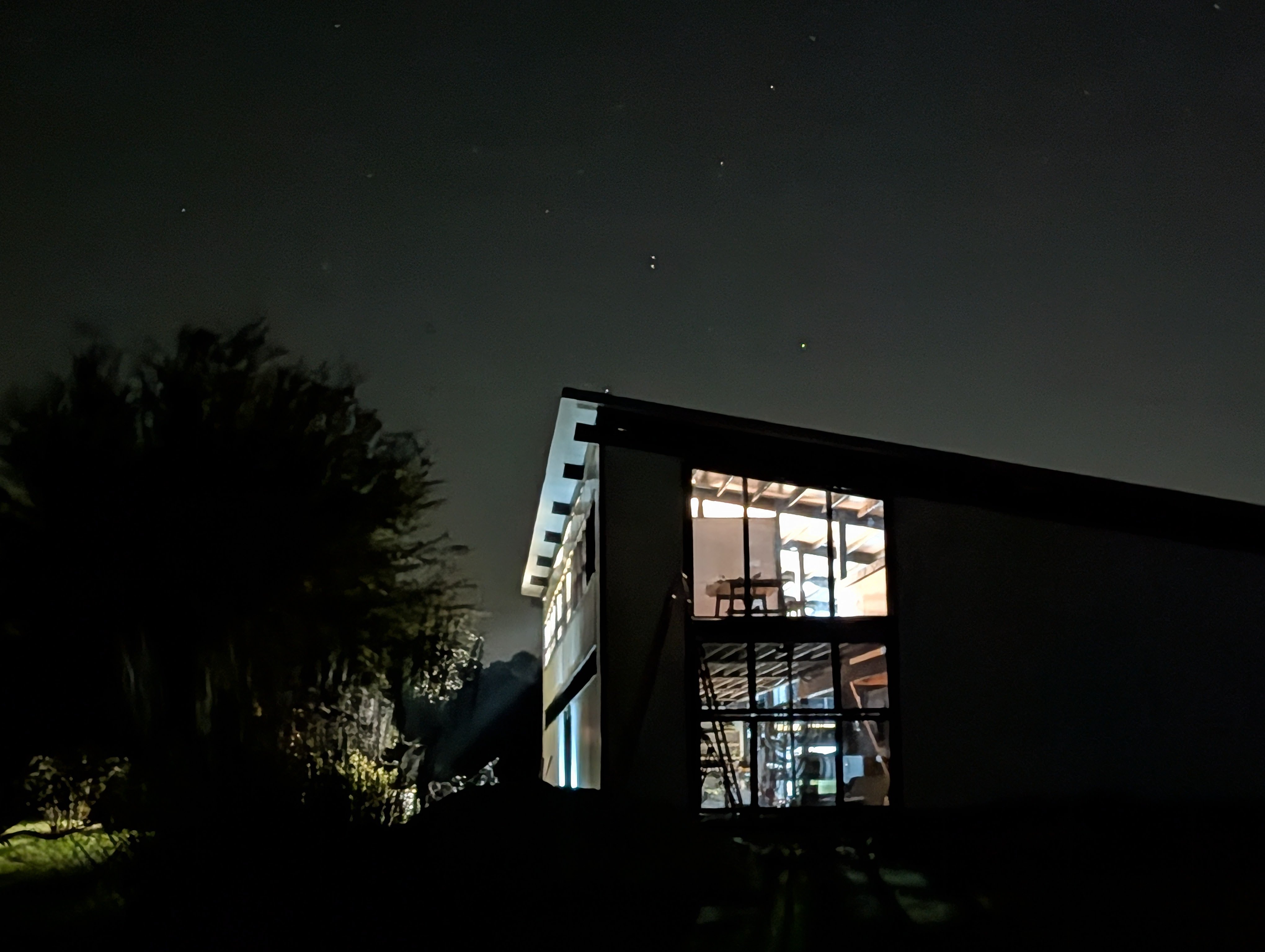 FarmSpace building at night with interior lights